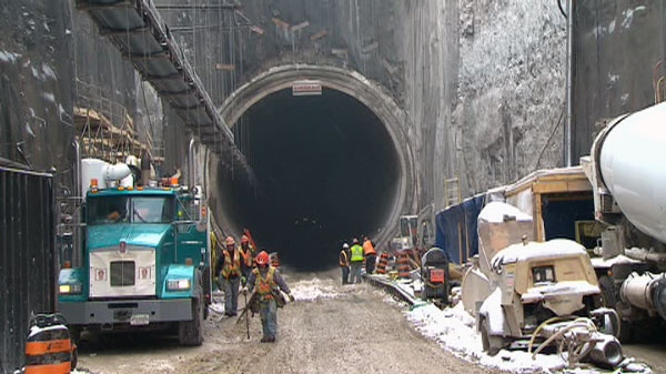 Crews work in a hydro tunnel being built under the City of Niagara Falls. The project is $615 million over budget and four years behind.