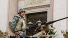 Egyptian soldiers guards Egypt's Stock Exchange Market, which has been closed for over a month, ahead of the scheduled opening for March 1, in Cairo, Egypt Monday, Feb. 28, 2011. (AP / Nasser Nasser)