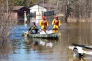 A resident of Burnt River paddles through flood waters on Sunday, April 21, 2013. (Tom Podolec / CTV Toronto)