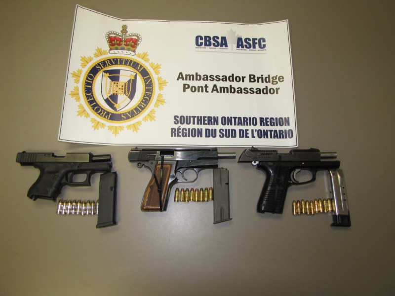 Firearms and ammunition magazines seized at the Ambassador Bridge are shown in this photo released by the Canada Border Services Agency. 