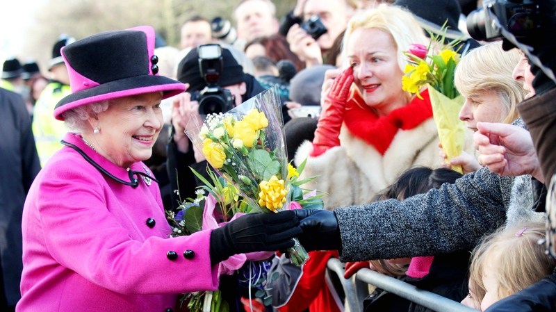 Britain's Queen Elizabeth II greets the crowds after visiting the Warwickshire Justice Centre in Leamington Spa, England, Friday March, 4, 2011. (AP / Jane Mingay)