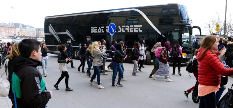Young girls run towards pop singer Justin Bieber's tour bus as it parks outside Grand Hotel where Bieber were staying during his concerts in Stockholm, Sweden, Tuesday April 23, 2013. (Scanpix Sweden, Leo Sellen) 