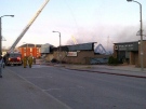 Fire crews pour water on the Seaforth Foodland fire on Saturday, April 27, 2013. (Courtesy Gerrid Dalton)