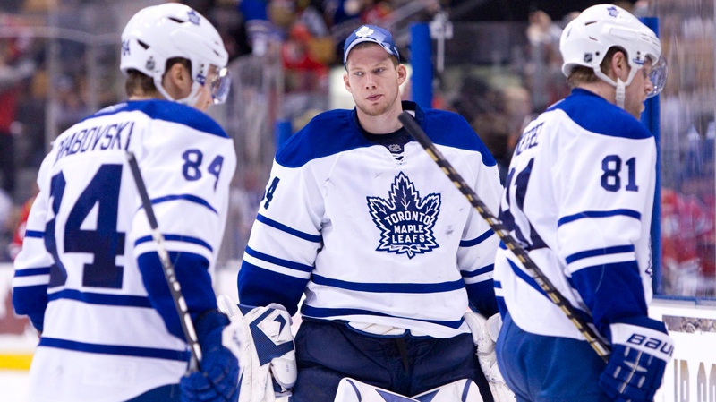 Toronto Maple Leafs' goaltender James Reimer, centre, watches as teammates Mikhail Grabovski, left, and Phil Kessel leave the ice following the Maple Leafs' 5-3 loss to the Chicago Blackhawks in NHL hockey action in Toronto Saturday, March 5, 2011. (Darren Calabrese / THE CANADIAN PRESS)  