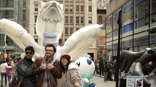 Anwar B., 19, Austen W., 19 and Lauren V., 25, pose with larger-than-life inflatable Pokemon from games for the Nintendo DS family of systems at the games' launch event in New York on March 5, 2011. (AP Images for Nintendo of America)