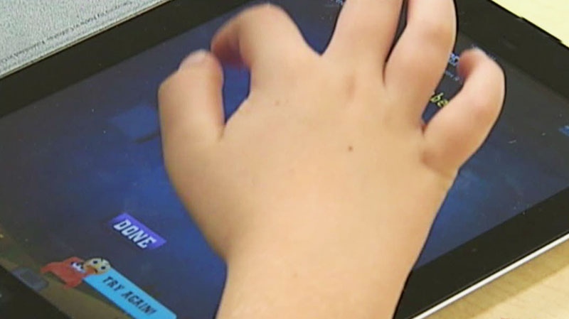 Child plays on an iPad
