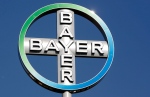 In this Sept. 25, 2008 file picture the logo of the Bayer AG chemical company rotates on top of an office building in Berlin, Germany. (AP Photo/Michael Sohn,file)