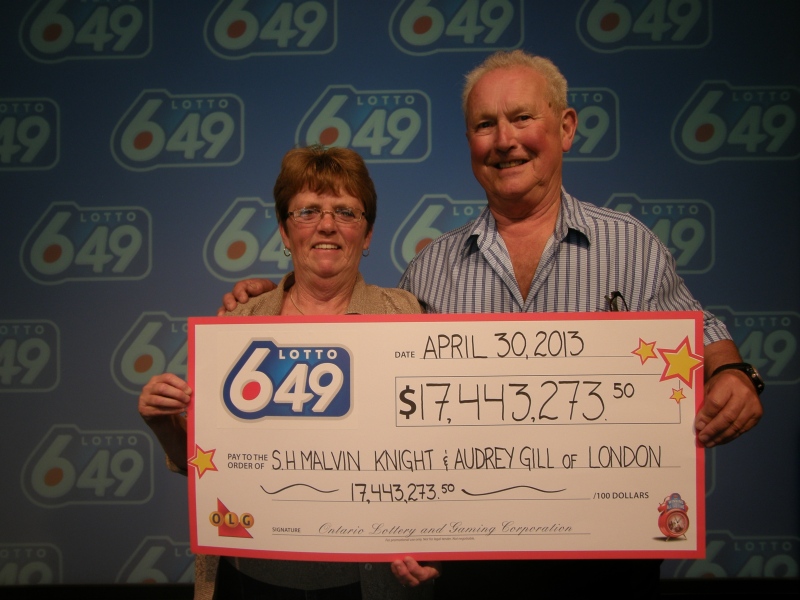 Malvin Knight and Audrey Gill of London pick up their cheque after winning Lotto 6/49 in Toronto, Ont. on Tuesday, April 30, 2013.