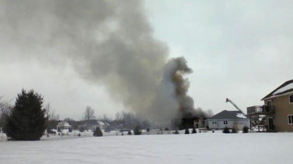 Flames tore through a residental home in Kemptville, Wednesday, March 9, 2011.