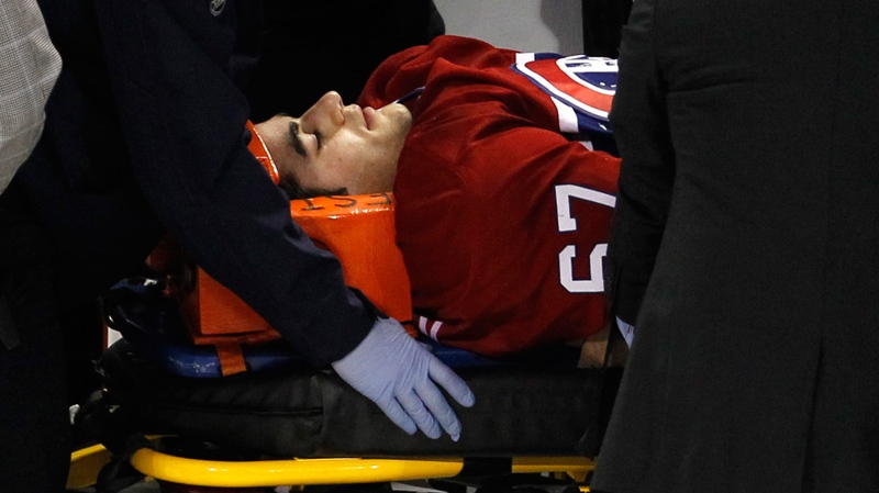 Montreal Canadiens' Max Pacioretty is wheeled away on a stretcher after taking a hit by Boston Bruins' Zdeno Chara during second period NHL hockey action Tuesday, March 8, 2011 in Montreal. (Paul Chiasson / THE CANADIAN PRESS)  