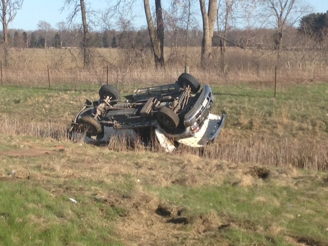 A vehicle flipped after reportedly losing control on the eastbound Highway 401 near Rodney, Ont. on Wednesday, May 1, 2013. (Christie Bezaire / CTV Windsor)