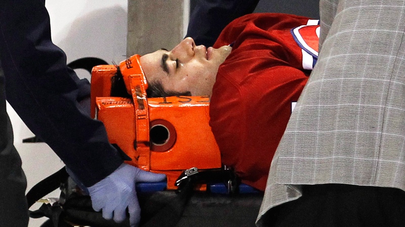 Montreal Canadiens' Max Pacioretty is wheeled away on a stretcher after taking a hit by Boston Bruins' Zdeno Chara during second period NHL hockey action Tuesday, March 8, 2011 in Montreal.(Paul Chiasson / THE CANADIAN PRESS)