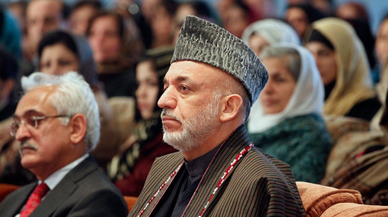 Afghan President Hamid Karzai attends a gathering to mark International Women's Day, in Kabul, Afghanistan on Tuesday, March 8, 2011. (AP / Musadeq Sadeq)