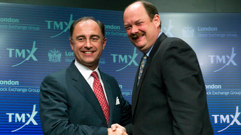 Xavier Rolet (left), CEO of the London Stock Exchange, and Thomas Kloet, CEO of TMX Group, shake hands following a press conference in Toronto on Wednesday, February 9, 2011 to announce the proposed merger of the London Stock Exchange and the TMX Group. (Chris Young / THE CANADIAN PRESS)