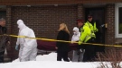 Officials remove a woman's body from a townhome on Fisher Avenue in Carleton Heights, Friday, March 11, 2011.