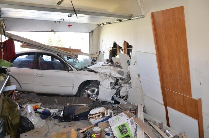 A car that crashed into a garage is seen in Leamington, Ont. on Sunday, May 4, 2013. (Beth Enns-Buhler / MyNews.CTVNews.ca)