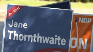 BC Liberal lawn signs surround an ad for the opposition NDP in North Vancouver. May 6, 2013. (CTV)