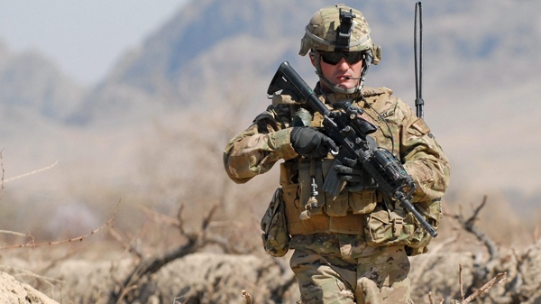 Army 1st Sgt. Raymond Dakos assigned to 1-66th Armor, 4th Infantry Division, patrols near Combat Outpost Kowall near the village of Tabin, Tuesday, March 8, 2011, in Kandahar, Afghanistan. (AP / U.S. Navy Ensign Haraz N. Ghanbari)