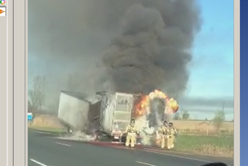 Firefighters battle a blaze in a tractor trailer on Highway 401 near London, Ont., on Tuesday, May 7, 2013. (Photo by Matt McGuire) 
