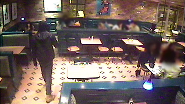 The suspect wanted in the theft of a painting from the Williams Coffee Pub on University Avenue is seen in this image from surveillance video released by Waterloo Regional police.
