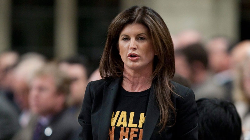 Minister of Public Works and Government Services and Minister for the Status of Women Rona Ambrose rises during Question Period in the House of Commons on Parliament Hill in Ottawa, Tuesday March 8, 2011. (Adrian Wyld / THE CANADIAN PRESS)