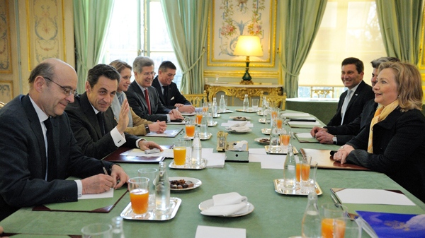 U.S. Secretary of State Hillary Rodham Clinton, right, attends a meeting with France President Nicolas Sarkozy, second left, and Foreign Minister Alain Juppe, left, at the Elysee Palace in Paris, Monday, March 14, 2011. (AP / Eric Feferberg, Pool)