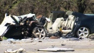 A damage vehicle remains at the scene of a crash on southbound Highway 404, Tuesday, March 7, 2013.