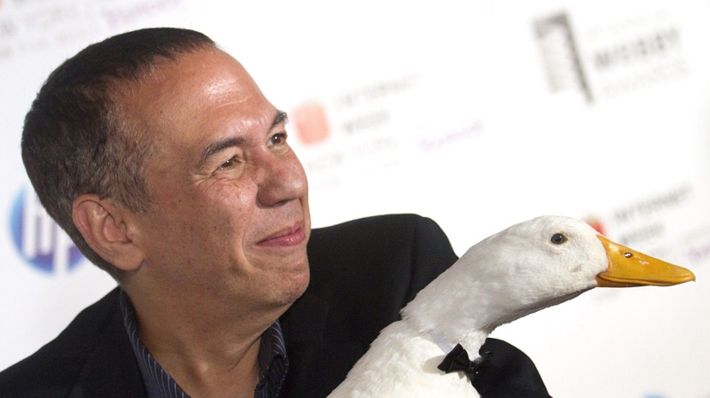 Gilbert Gottfried arrives with the Aflac Duck to the 14th Annual Webby Awards in New York, Monday, June 14, 2010. 