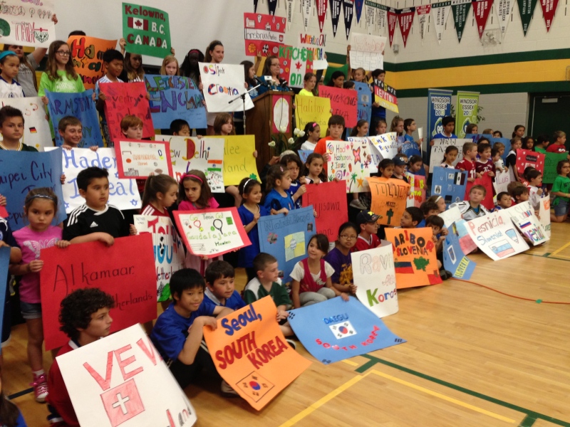 Students at Notre Dame school hold up signs supporting the International Children's Games in Windsor, Ont., on Friday, May 10, 2013. (Michelle Maluske / CTV Windsor)