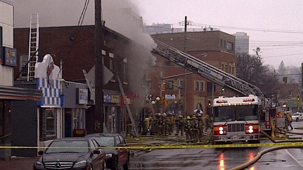 Firefighters work to put out a fire at a Home Hardware store on Beechwood Avenue, Wednesday, March 16, 2011.