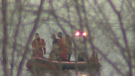 Rescuers scour the South Saskatchewan River for a woman who jumped off the University Bridge on Tuesday night.