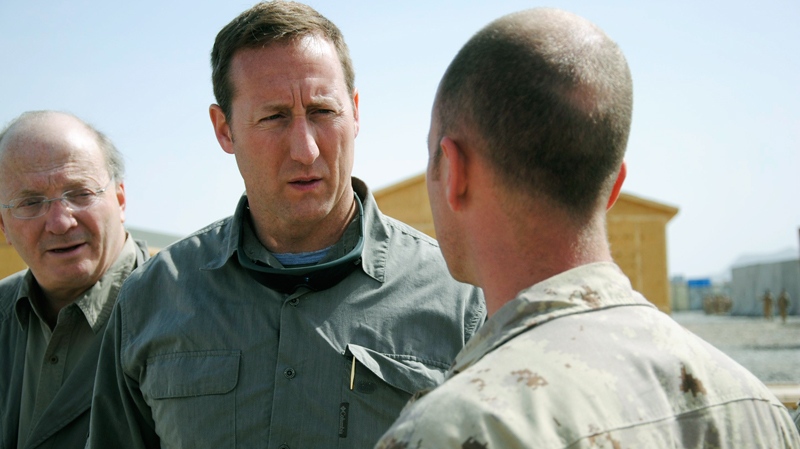 Defence Minister Peter MacKay speaks with a Canadian troop while visiting a forward operating base in Zangabad, Afghanistan on Thursday, March 17, 2011. (Tara Brautigam / THE CANADIAN PRESS)