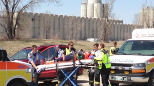 Emergency crews transported people to hospital following the crash on Kenaston in Winnipeg on May 13, 2013.


