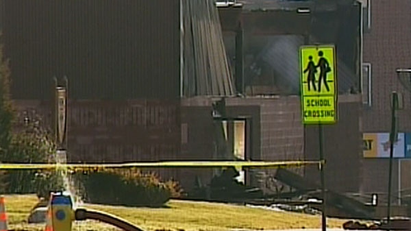 The smoldering building of the Dollar Stop in downtown Listowel, Ont., is seen in this image taken from video Friday, March 18, 2011. 