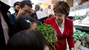 B.C Premier and Liberal Leader Christy Clark jokes with young girls during a campaign stop at Teng's Market in Vancouver, B.C., on Monday May 13, 2013. British Columbians go to the polls Tuesday for a provincial election. THE CANADIAN PRESS/Darryl Dyck