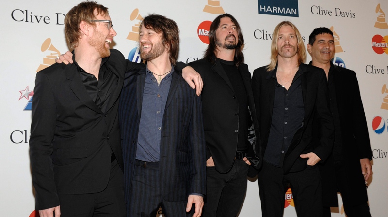 From left, Musicians Nate Mendel, Chris Shiflett, Dave Grohl, Taylor Hawkins and Pat Smear, of the Foo Fighters, arrives at the Pre-Grammy Gala and Salute to Industry Icons with Clive Davis honouring David Geffen on Saturday, Feb. 12, 2011 in Beverly Hills, Calif. (AP / Dan Steinberg)