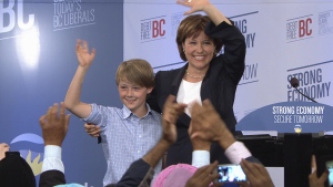 Incumbent B.C. Premier Christy Clark celebrates her historic election victory with 11-year-old son Hamish at the BC Liberals' campaign headquarters in downtown Vancouver. Clark was elected B.C.'s first female premier. May 14, 2013. (CTV)