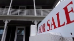 A for sale sign hangs in front of a house in this March 2013 file photo. (AP Photo, Steven Senne)