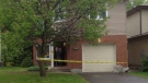 Police tape surrounds a home on Fernleaf Crescent where a man was stabbed the afternoon of Wednesday, May 15, 2013.