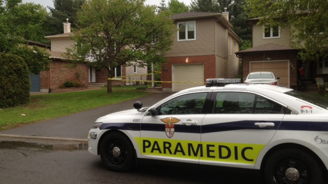 Paramedic on standby in front of Orleans home