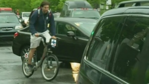 A bicyclist dodges traffic in NDG. 