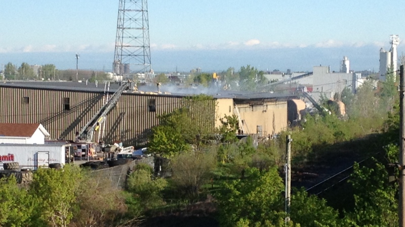 Fire officials say about 15 workers were in the warehouse Thursday morning when a fire broke out in an area where bales of recyclable paper were stacked about six metres high.