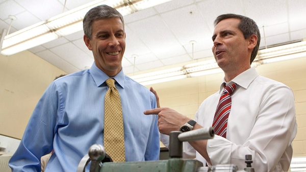 Dalton McGuinty (right) points to U.S. Secretary of Education Arne Duncan during their tour of Weston Collegiate Institute in Toronto on Monday, Sept 13, 2010. (Pawel Dwulit / THE CANADIAN PRESS)