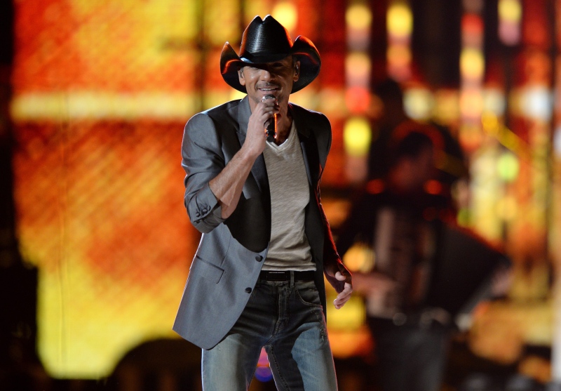FILE - This April 8, 2013, file photo shows Tim McGraw performs at ACM Presents: Tim McGraw's Superstar Summer Night at the MGM Grand Garden Arena in Las Vegas. (Photo by Al Powers/Invision/AP, file)