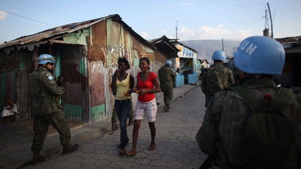 UN peacekeepers from Brazil patrol in the slum of Cite Soleil, Port-au-Prince, Haiti, Monday, March 21, 2011. (AP / Alexandre Meneghini)