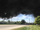 Thick, black smoke billows from a fire in the 700 block of Sprucewood Avenue in Windsor, Ont., on Tuesday, May 21, 2013. (Sacha Long / CTV Windsor)