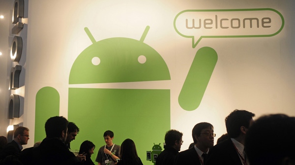 Participants gather around the Google Android stand at the Mobile World Congress in Barcelona, Spain, Thursday, Feb. 17, 2011. (AP Photo/Manu Fernandez)