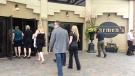 Mourners arrive for the memorial of Tim Bosma at Carmen's Banquet Hall in Hamilton, Ont., Wednesday, May 22, 2013. (Byron Auburn / CTV Toronto)