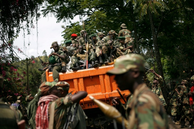 M23 rebels sit in a vehicle as they withdraw from the eastern Congo town of Goma in this Dec. 1, 2012 file photo. (AP / Jerome Delay)
