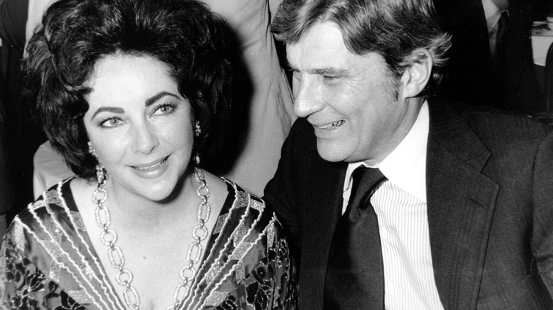 Elizabeth Taylor and husband, former secretary of the U.S. Navy John Warner, at the 42nd New York Film Critics Circle Awards dinner in New York, Jan. 30, 1977. (AP Photo)
